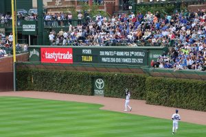 Ian Happ prepares to catch ball as  Pete Crow Armstrong watches