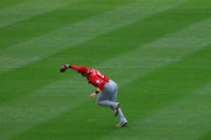 Jake Fraley catches ball for Reds