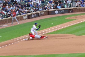 Cody Bellinger prepares to catch throw from pitcher on a pickoff attempt