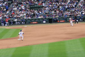 Cubs third baseman throws to second baseman for a force out