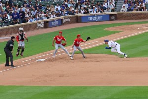 Pete Crow-Armstrong trys to get back to first base