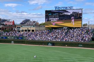 Anthony Rizzo standing in center field crouched over