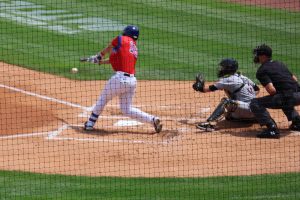 Batter hits ball to ground