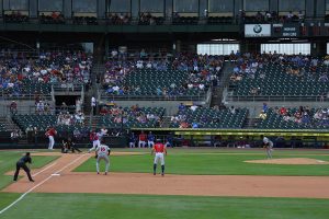 Rear view of man leading off first