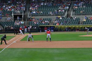 Rear view if first baseman setting up for pitch