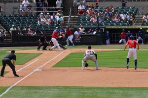 Runner jumps to run on pitch