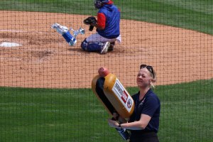 Girls uses thrower to throw hotdogs 