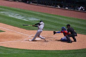 Indianapolis batter swings and hits ball