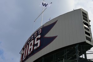 Side angle of scoreboard with W flag flying