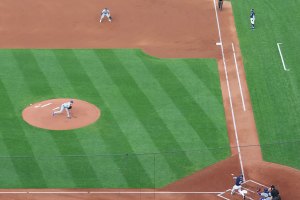 Ball inf front of batter swinging