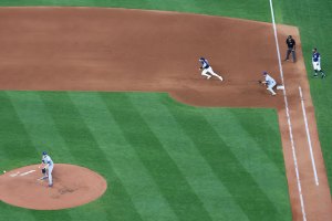 Player running from first during pitch